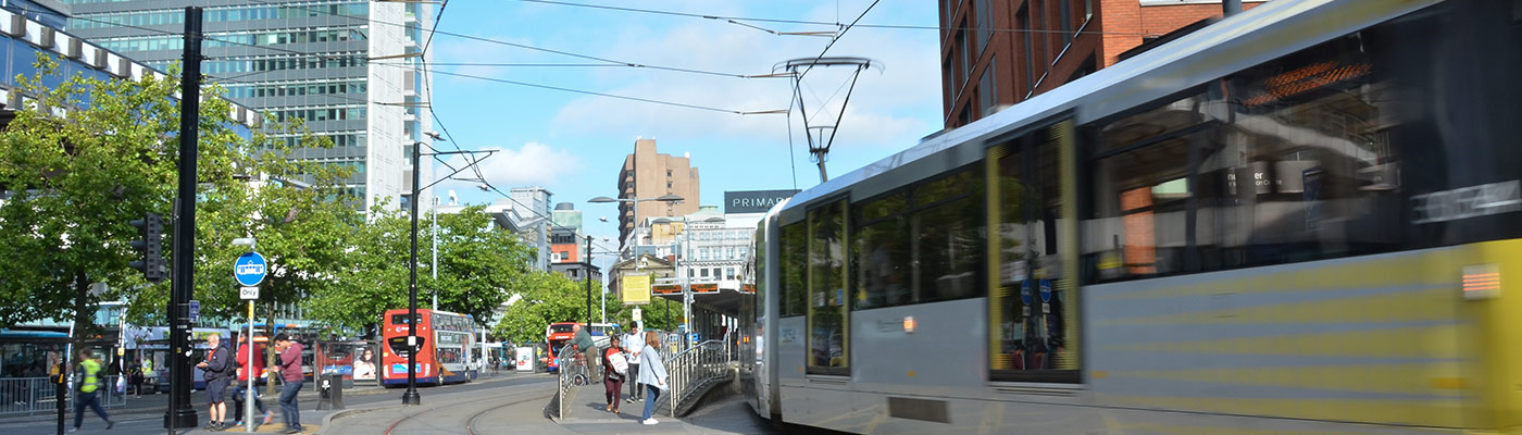 A tram leaving Piccadilly gardens in Manchester city centre