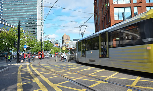 A tram leaving Piccadilly gardens in Manchester city centre