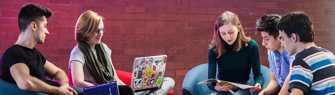 Group of students talking in a social space